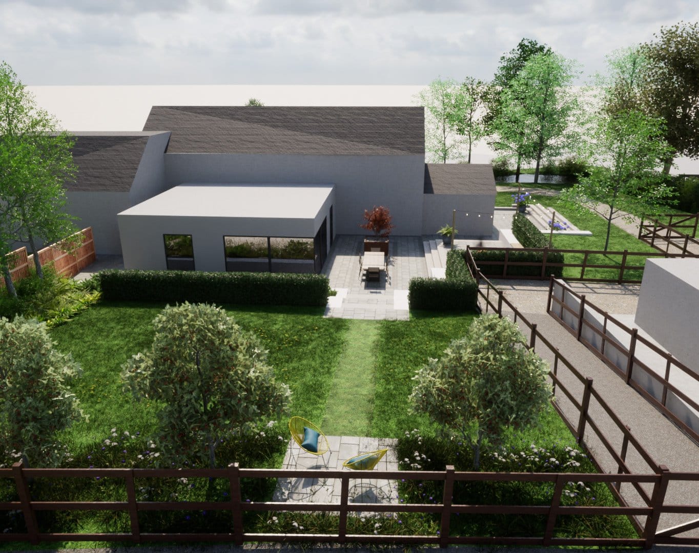 A series of terraces and lawn create a gentle transition through the garden towards the outbuilding, with the open field boundary reinforcing the connection to the surrounding rural landscape.