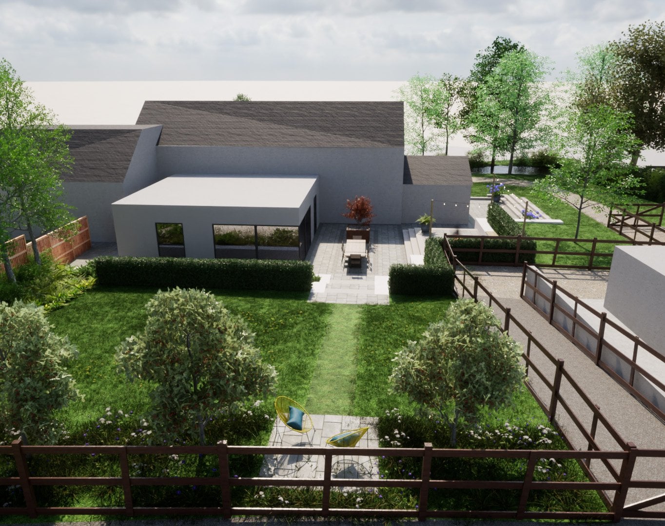 A series of terraces and lawn create a gentle transition through the garden towards the outbuilding, with the open field boundary reinforcing the connection to the surrounding rural landscape.