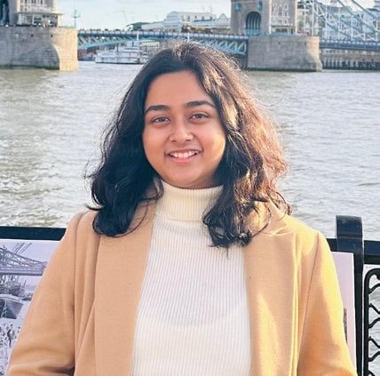 Portrait of Sukanya Borua, Graduate Landscape Architect at DAC Landscape Architecture, by a river.